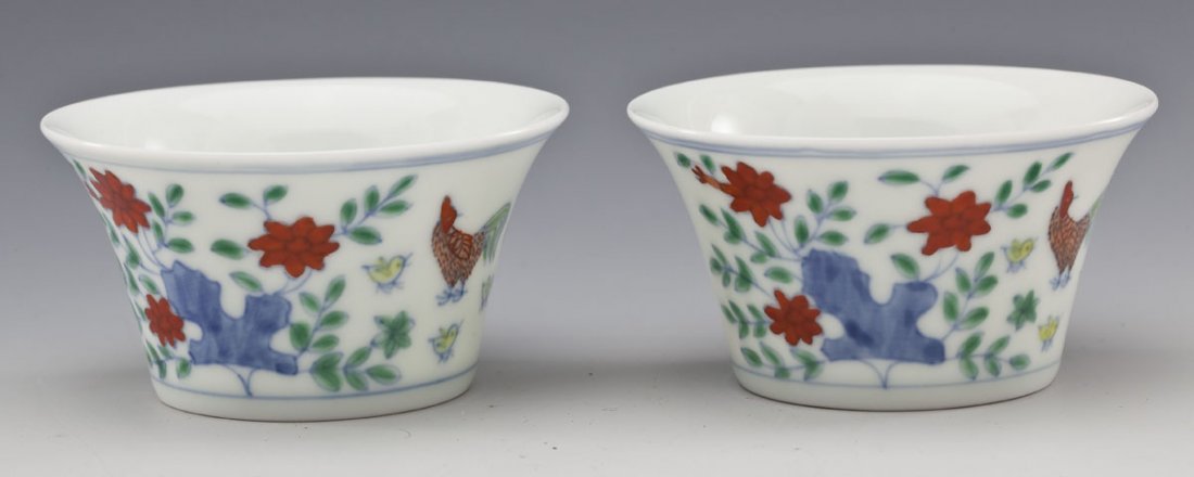 Pair of Chinese Doucai Porcelain Wine Cups: DESCRIPTION: Pair of Chinese doucai glaze porcelain wine cups. Floral motif with chickens. Six character Ming Chenghua mark upon the base, not of the period. MEASUREMENTS: 1-5/8" x 3". CONDITION: No d