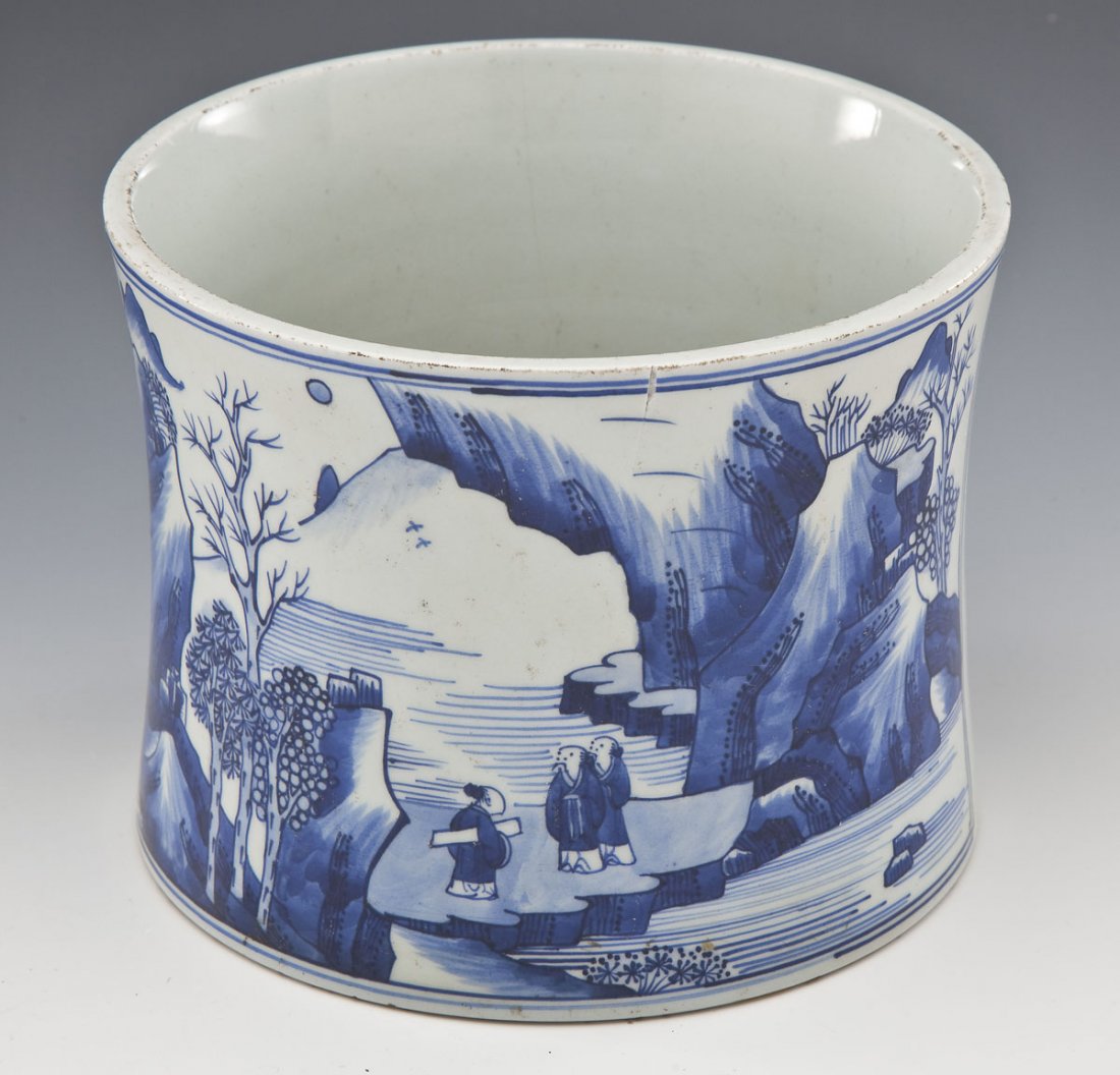 Chinese Kangzi Mark Brush Pot: DESCRIPTION: Chinese brush pot with cobalt blue landscape decorations atop a white field. Kangzi four character mark upon the base, not of the period. MEASUREMENTS: 5-3/4" x 7-3/8". CONDITION: Hairlin
