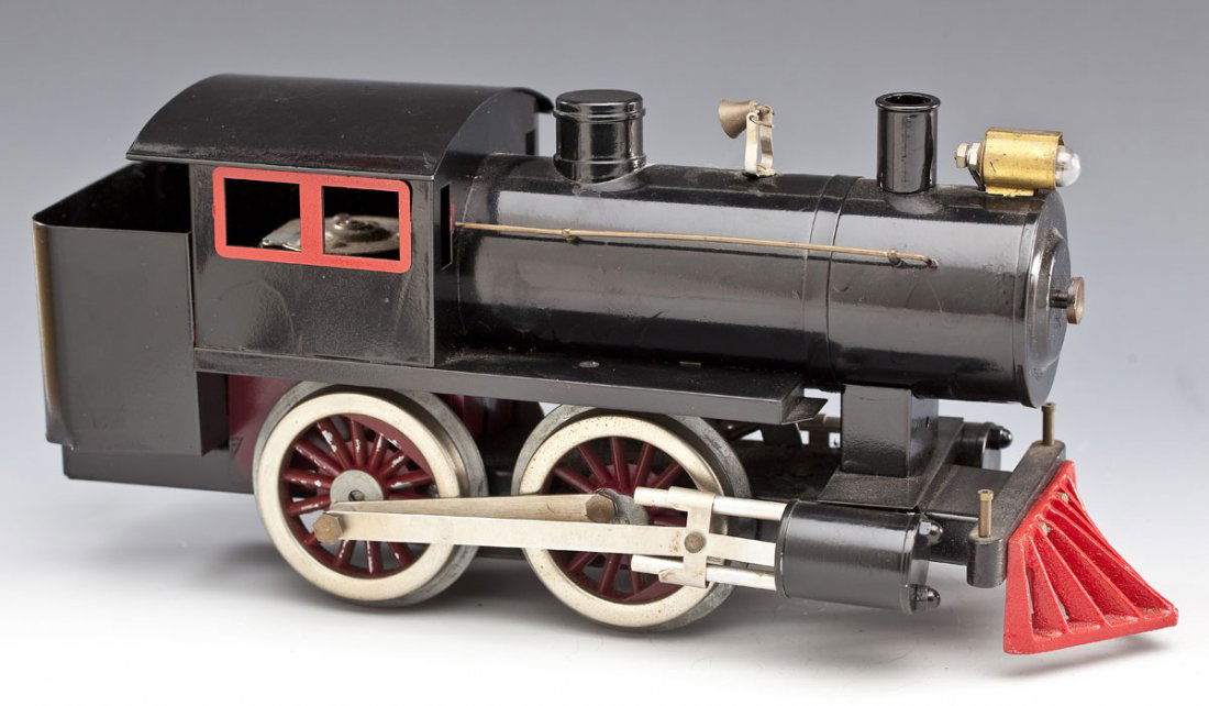 Tin Standard Gauge Train with Pittman Motor: DESCRIPTION: Tin standard gauge train with Model Engineering Works wheels and Pittman 12 volt motor. MEASUREMENTS: 12" long x 5-1/2" high. CONDITION: Appears to have been repainted. Some wear to paint