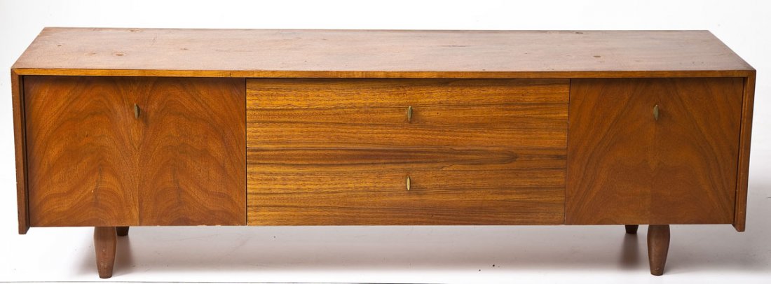 Mid-Century Sideboard: DESCRIPTION: A mixed woods mid-century sideboard in various figured exotic veneers and white laminate. The geometric form resting on simple turned legs with vertical hardware and simple decoration. ME
