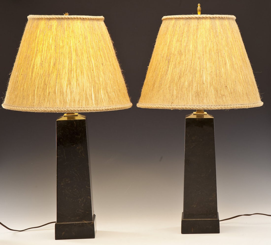 Pair Artemis Studios Marble Geometric Lamps: DESCRIPTION: Pair of Artemis Studios marble geometric lamps with rattan shades. MEASUREMENTS: Each: 31" tall x 14" shade diameter. CONDITION: Each working. One lamp with loose neck. Minor wear to surf