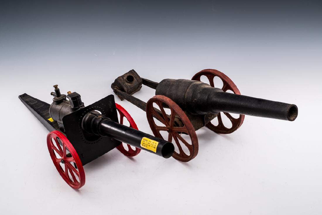 2 Big Bang Cannons incl Major Field Cannon: DESCRIPTION: Two Big Bang cannons. Includes: 1) Major Field Cannon with paper labels to barrel and intact carriage. 24-1/2" long. 2) Siege field gun. 22-1/2" long. MEASUREMENTS: See Description. CONDI