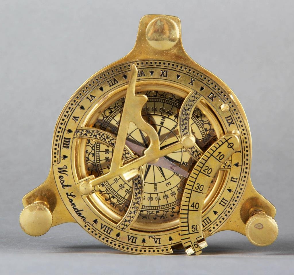 A Brass Compass: Raised on adjustable feet, signed West London, 4.75"D X 3.25"H, circa 20th century.