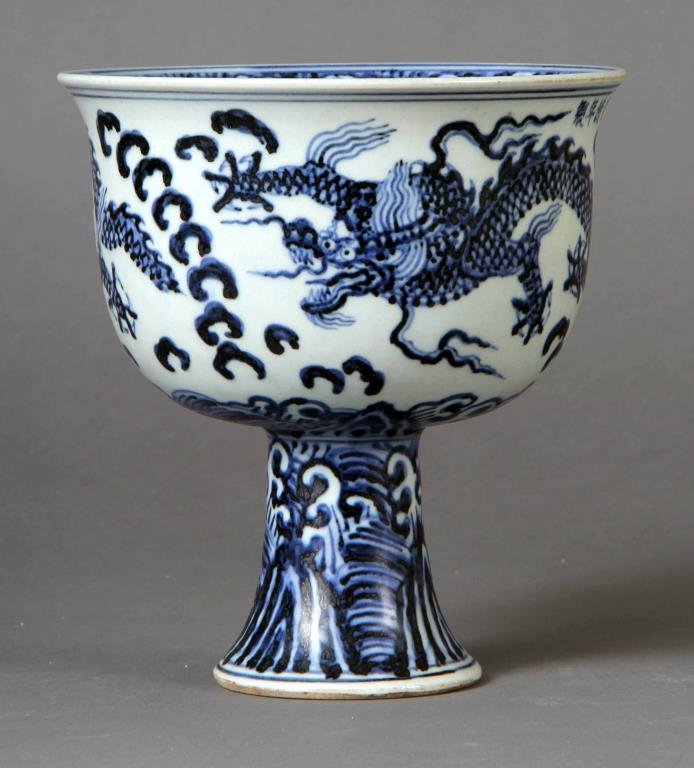 Chinese Ming Style Blue & White Porcelain Chalice Cup: Finely painted to depict two five clawed dragons, ruyi clouds, having a four character signature in underglaze blue to side of rim, further decorate to the inside of blow depicting a third five clawed