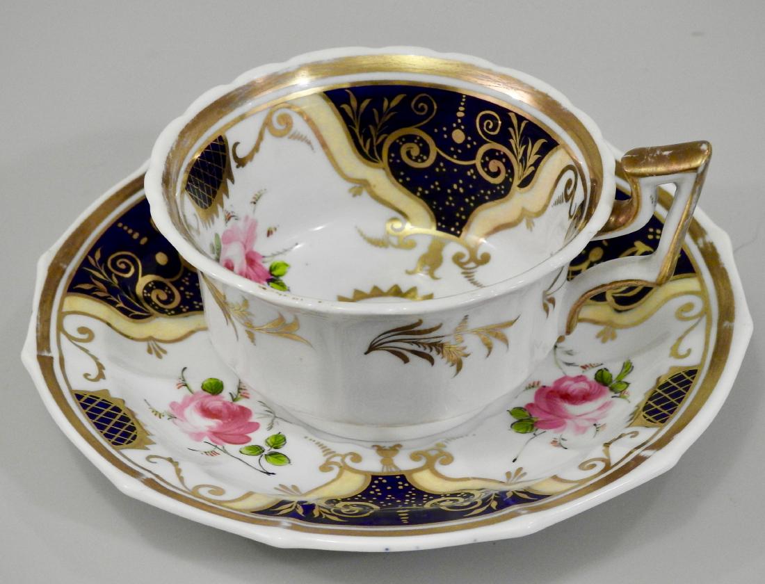 Antique Cobalt Gold English Tea Cup and Saucer: Antique Cobalt Gold English Tea Cup and Saucer Cup is approximately 1 7/8 inches tall and 3 11/16 inches in diameter; saucer is 6 inches in diameter.