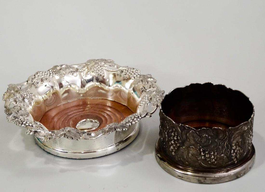 Wine Bottle Coasters Lot of 2 Embossed Grape Pattern: Wine Bottle Coasters Lot of 2 Embossed Grape Pattern 2 1/4 x 4 1/8 inches in diameter; inner diameter about 3 1/4 inches.