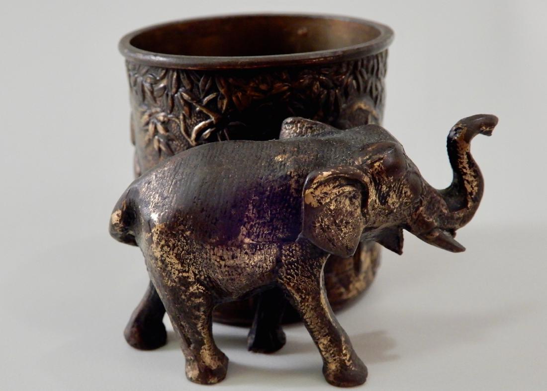 Vintage Bronzed Spelter Elephant Vase Toothpick Holder: Vintage Bronzed Spelter Elephant Vase Toothpick Holder Approximately 2 1/4 x 2 1/4 x 1 5/8 inches tall.
