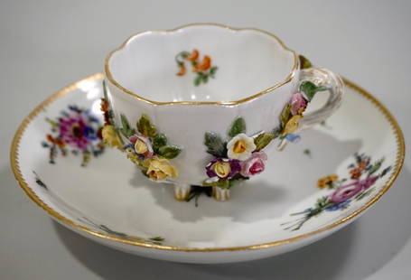 Meissen Porcelain Floral Encrusted Demitasse Cup: Meissen Porcelain Floral Encrusted Demitasse Cup Applied Flowers Hand Painted Meissen Saucer Lot of 2 Cup is approximately 3 1/8 x 2 3/8 x 1 3/4 inches tall; saucer is about 4 7/8 inches in diameter.