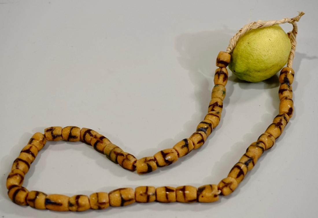 Trading Glass Beads Yellow Strand: Trading Glass Beads Yellow Strand Approximately 20 1/2 inches long.