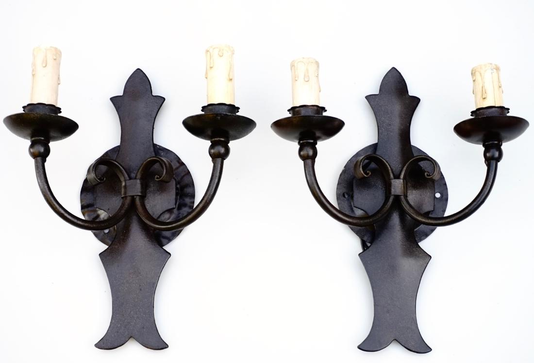 Pair Iron Electric Wall Sconces Made in Italy: Pair Iron Electric Wall Sconces Made in Italy Each is approximately 11 x 9 3/8 inches wide and extend out of the wall on about 4 1/4 inches. Backplate is about 4 1/4 inches in diameter.