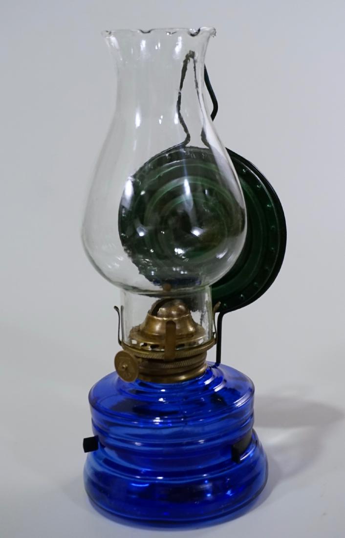 Nasco Miniature Kerosene Lamp Cobalt Glass Font Tin: Nasco Miniature Kerosene Lamp Cobalt Glass Font Tin Reflector Approximately 8 1/4 inches tall overall.