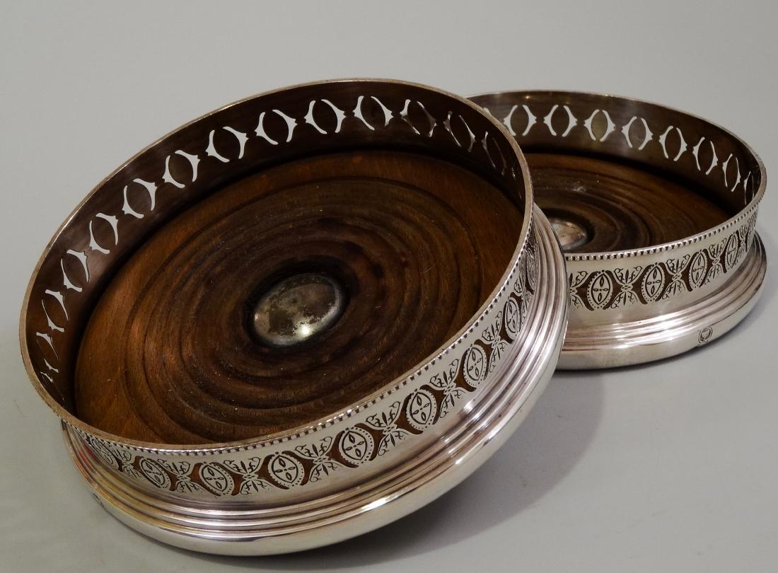 Antique English Silver Plate Wine Bottle Coasters Ellis: Antique English Silver Plate Wine Bottle Coasters Ellis Barker Menorah Mark c1912 Lot of 2 Approximately 1 7/16 x 5 1/2 inches in diameter; inner diameter approximately 4 13/16 inches.