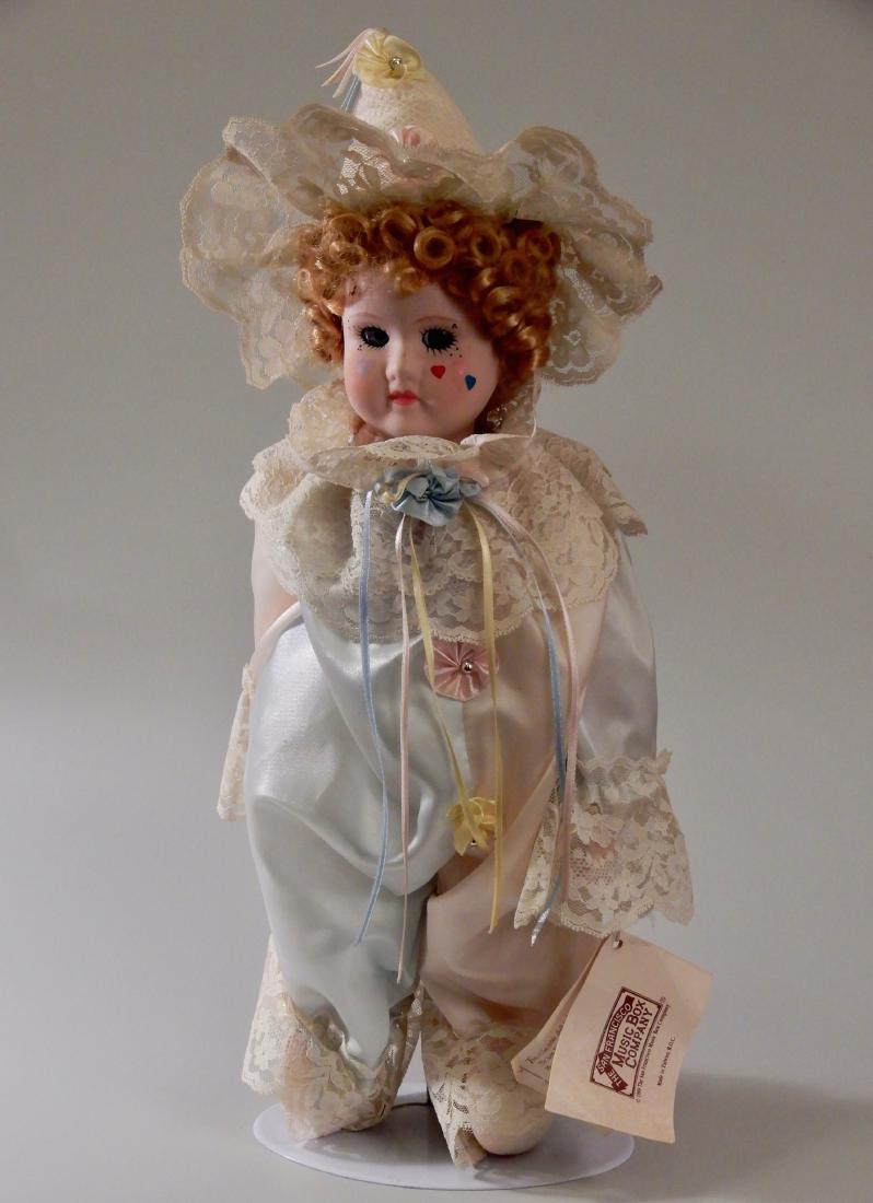 Clown Doll San Francisco Music Box Co. The Sound of: Clown Doll San Francisco Music Box Co. The Sound of Music Plays My Favorite Things tune from 1965 film The Sound of Music (display stand is not included) Approximately 17 inches tall.