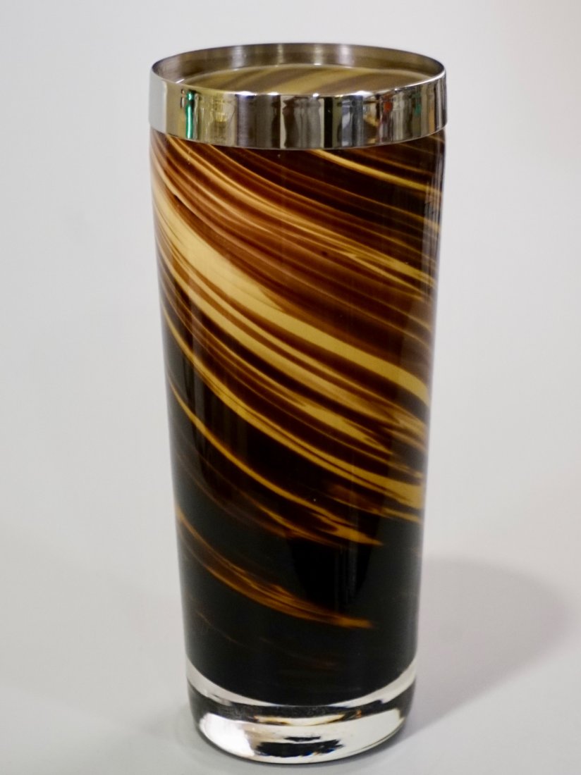 Modern Art Glass Swirl Vase White Metal Rim: Modern Art Glass Swirl Vase White Metal Rim Approximately 3 1/4 inches in diameter x 7 7/8 inches tall.