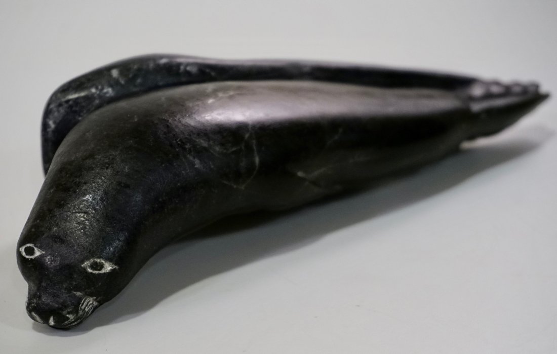 Eskimo Inuit Carved Stone Seal Figurine Signed: Eskimo Inuit Carved Stone Seal Figurine Signed Approximately 8 9/16 x 2 3/8 x 2 7/8 inches.