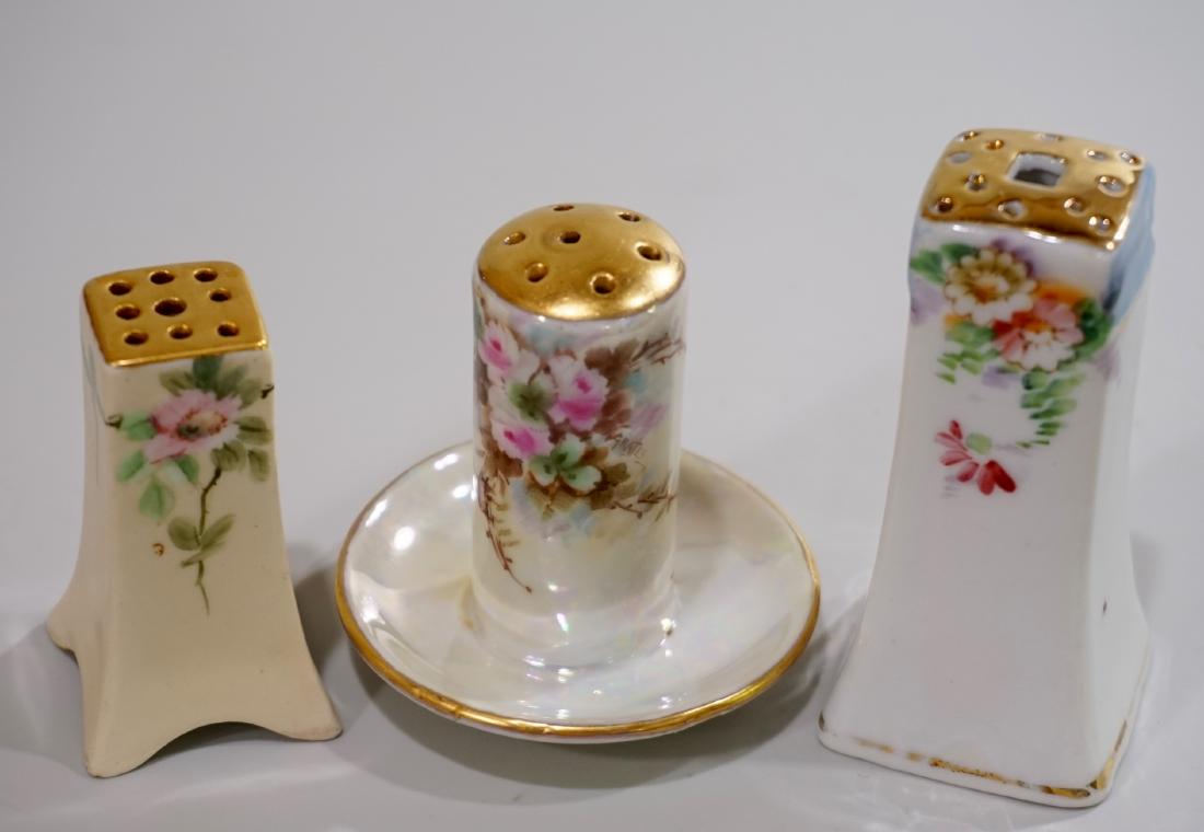 Art Nouveau Period Porcelain Hat Pin Holders Lot of 3: Art Nouveau Period Porcelain Hat Pin Holders Lot of 3 Approximately 3; 2 7/16 and 2 1/8 inches tall.