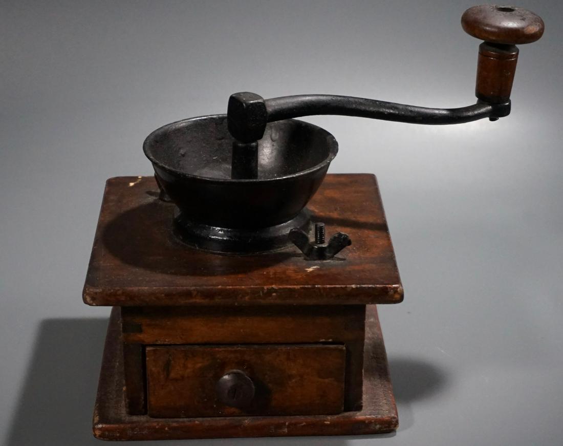 Antique Coffee Grinder: Antique Coffee Grinder Approximately 8 7/16 inches tall overall on a base approximately 6 1/2 x 5 13/16 inches.