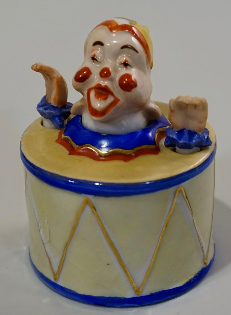 Articulated Nodder Clown in Drum Vintage Porcelain Made: Articulated Nodder Clown in Drum Vintage Porcelain Made in Japan Approximately 3 _ inches tall x 2 _ inches in diameter.