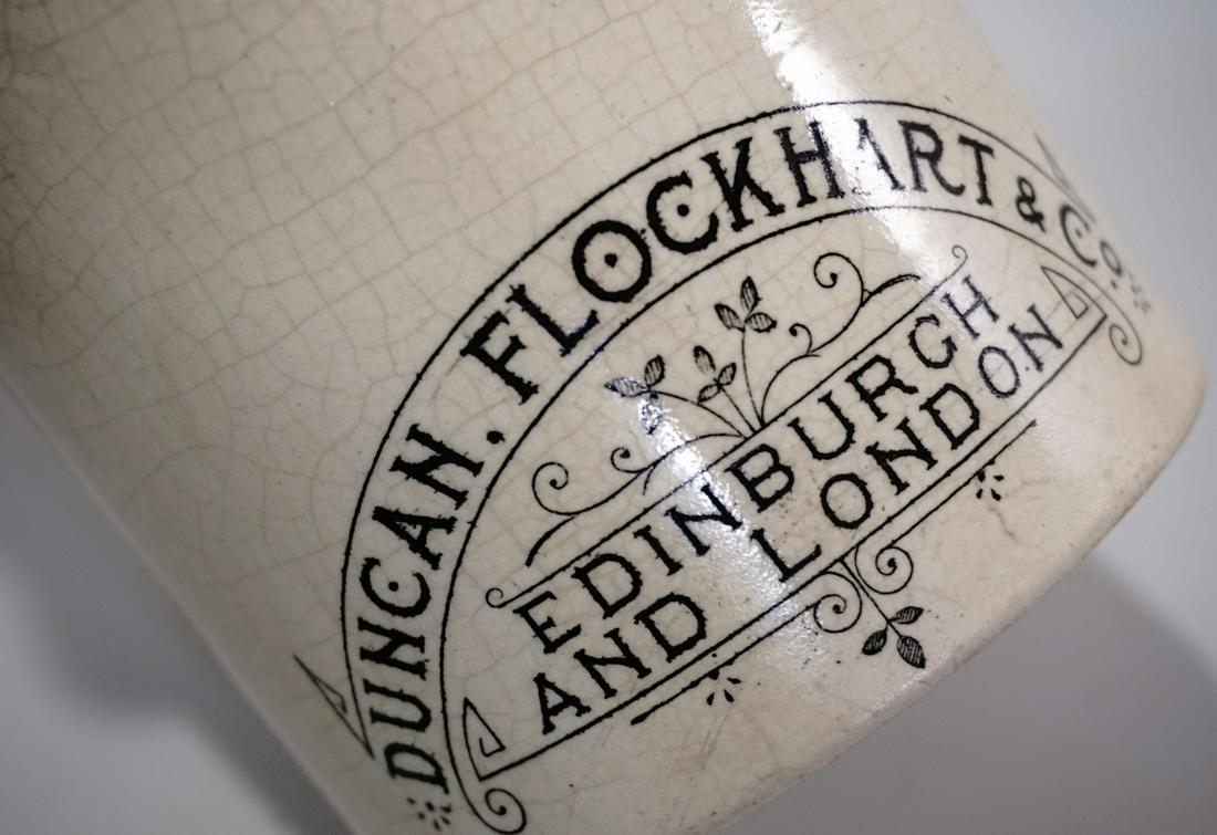 Antique English Pharmaceutical Advertising Jar DUNCAN: Antique English Pharmaceutical Advertising Jar DUNCAN FLOCKHART & Co. EDINBURGH AND LONDON Ointment Pot complete with the lid. Approximately 5 9/16 inches tall x 3 7/8 inches in diameter.