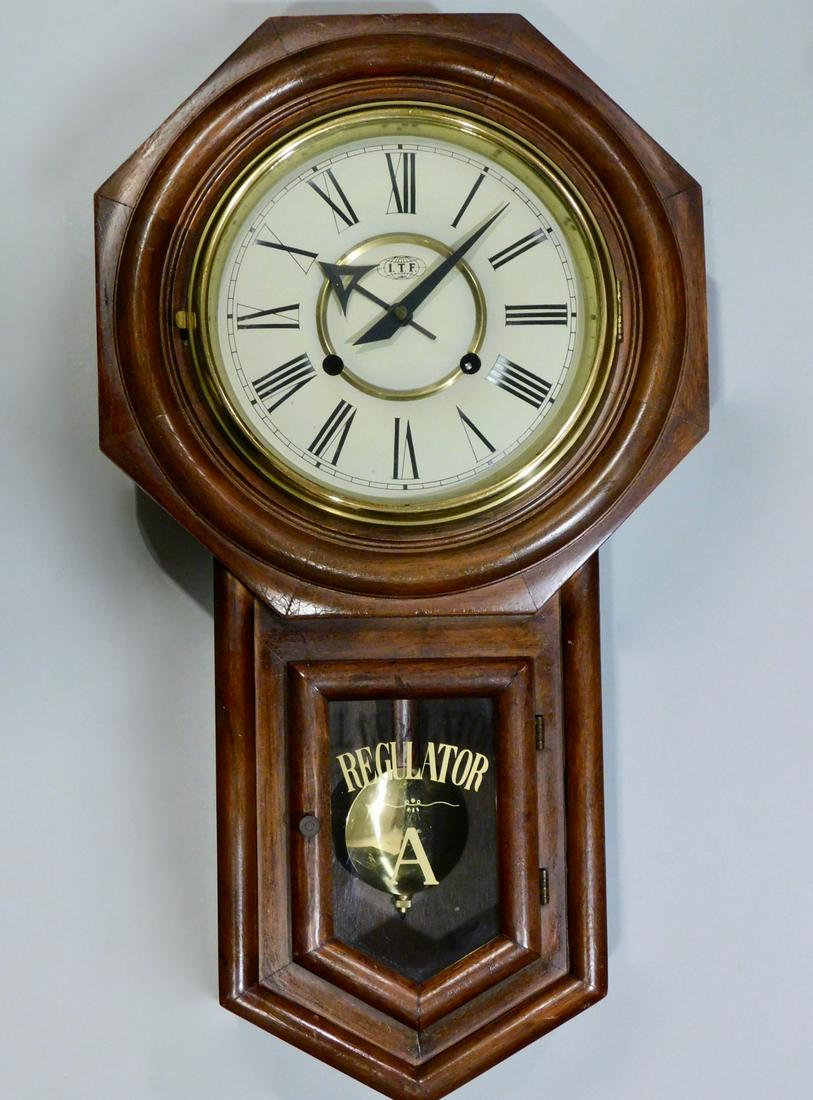 I T F Regulator Wall Pendulum Clock: T F Regulator Wall Pendulum Clock Approximately 22 1/8 x 12 1/4 x 4 3/4 inches.