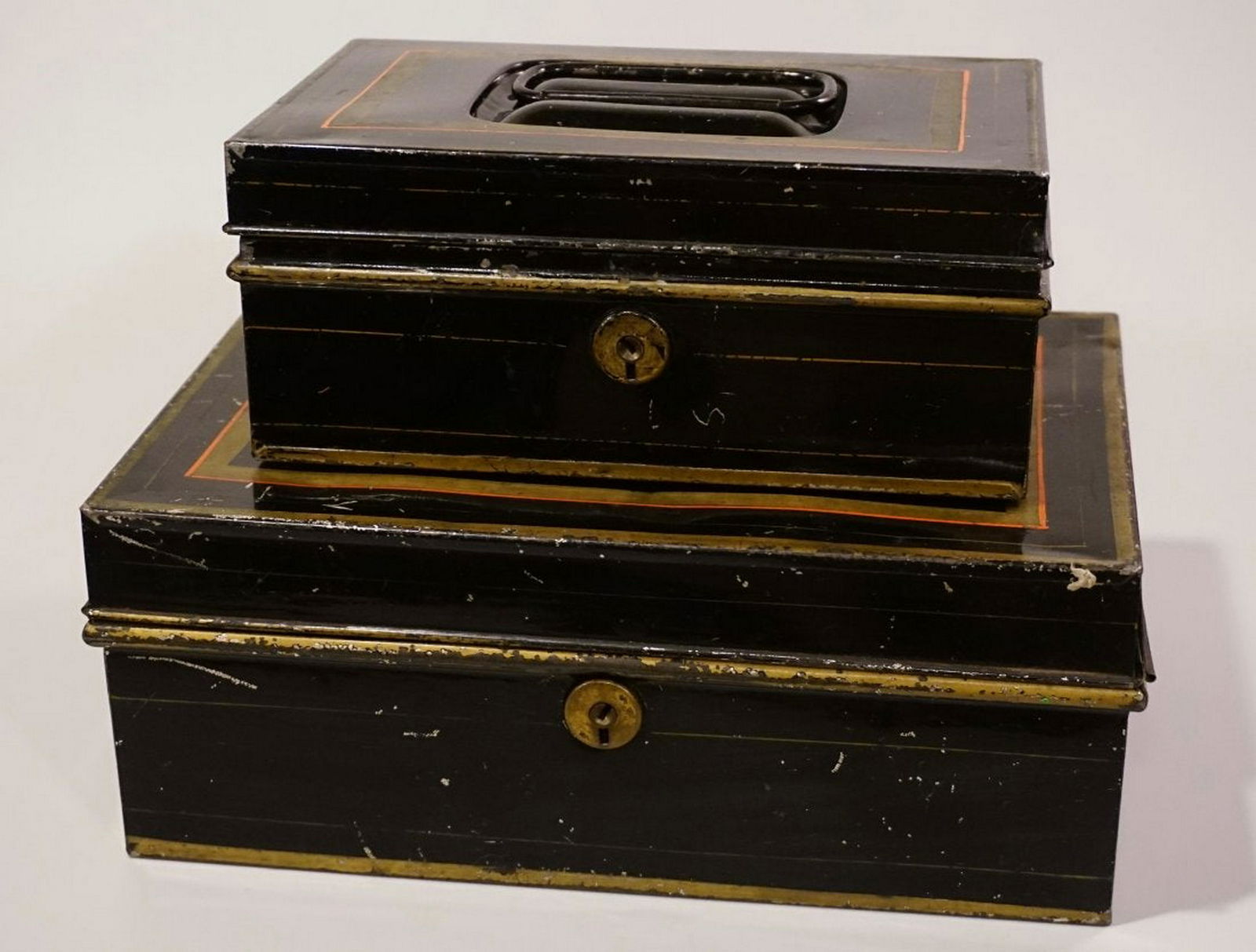 Antique Cash Tin Safe Money Boxes Lot of 2: Antique Cash Tin Safe Money Boxes Lot of 2 Approximately 10 3/4 x 7 1/4 x 4 1/8 inches and 8 3/16 x 5 9/16 x 3 3/8 inches.