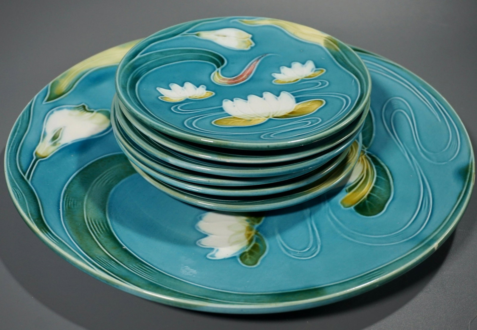 Antique German Majolica Water Pond Lily Black Forest: Antique German Majolica Water Pond Lily Black Forest Art Pottery Cake Set of 7 Faience Plates Plates are approximately 5 7/8 inches in diameter; tray is about 11 1/6 inches in diameter.