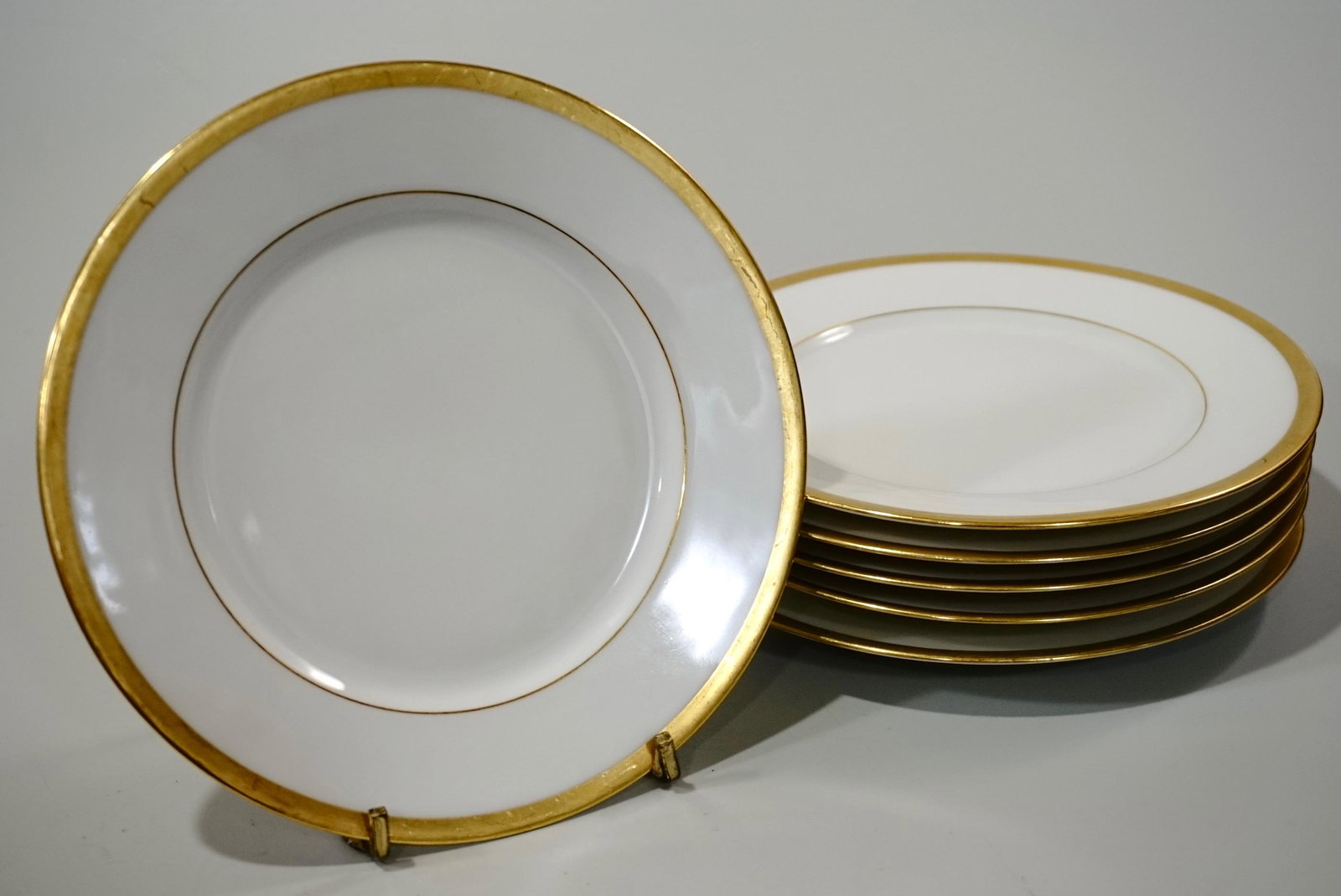 Limoges France Plates White Porcelain Gold Rim Charles: Limoges France Plates White Porcelain Gold Rim Charles Ahrenfeldt Retailed by Gumps of San Francisco Approximately 6 5/16 inches in diameter.