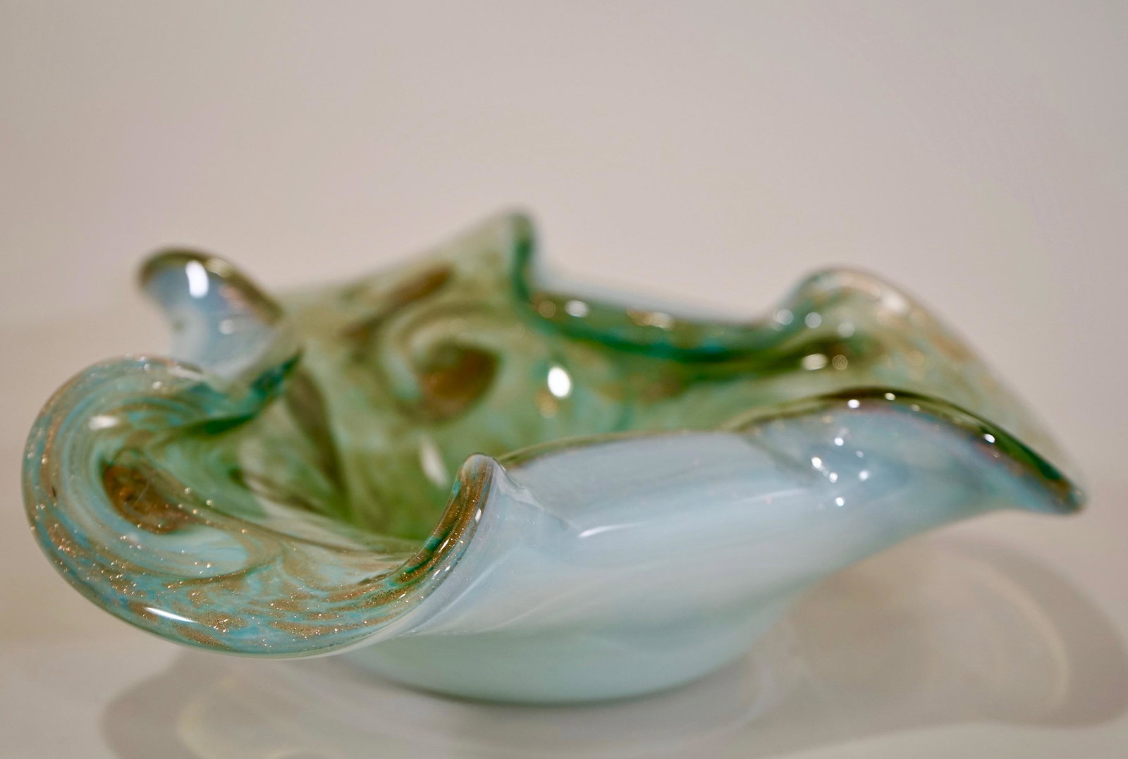 Opalescent Cased Blue Gold Speck Murano Venetian Art: Opalescent Cased Blue Gold Speck Murano Venetian Art Glass Bowl Mid Century Modern Bullicante Sommerso Attributed to Bullicante Sommerso Approximately 2 11/16 x 8 1/2 inches in diameter.