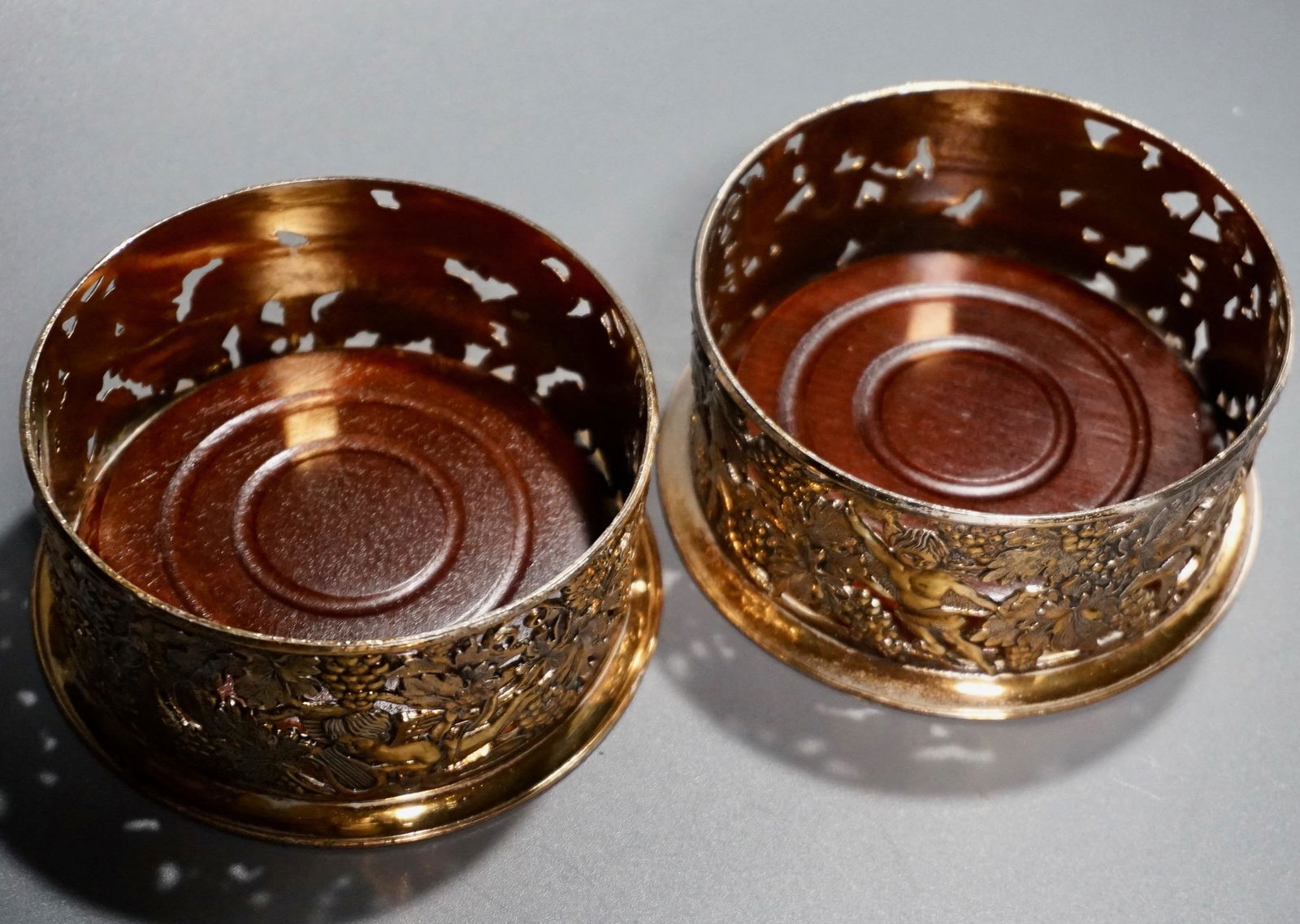 Silver Plated Wine Bottle Coasters Lot of 2: Silver Plated Wine Bottle Coasters Lot of 2 Approximately 4 3/16 inches in diameter.