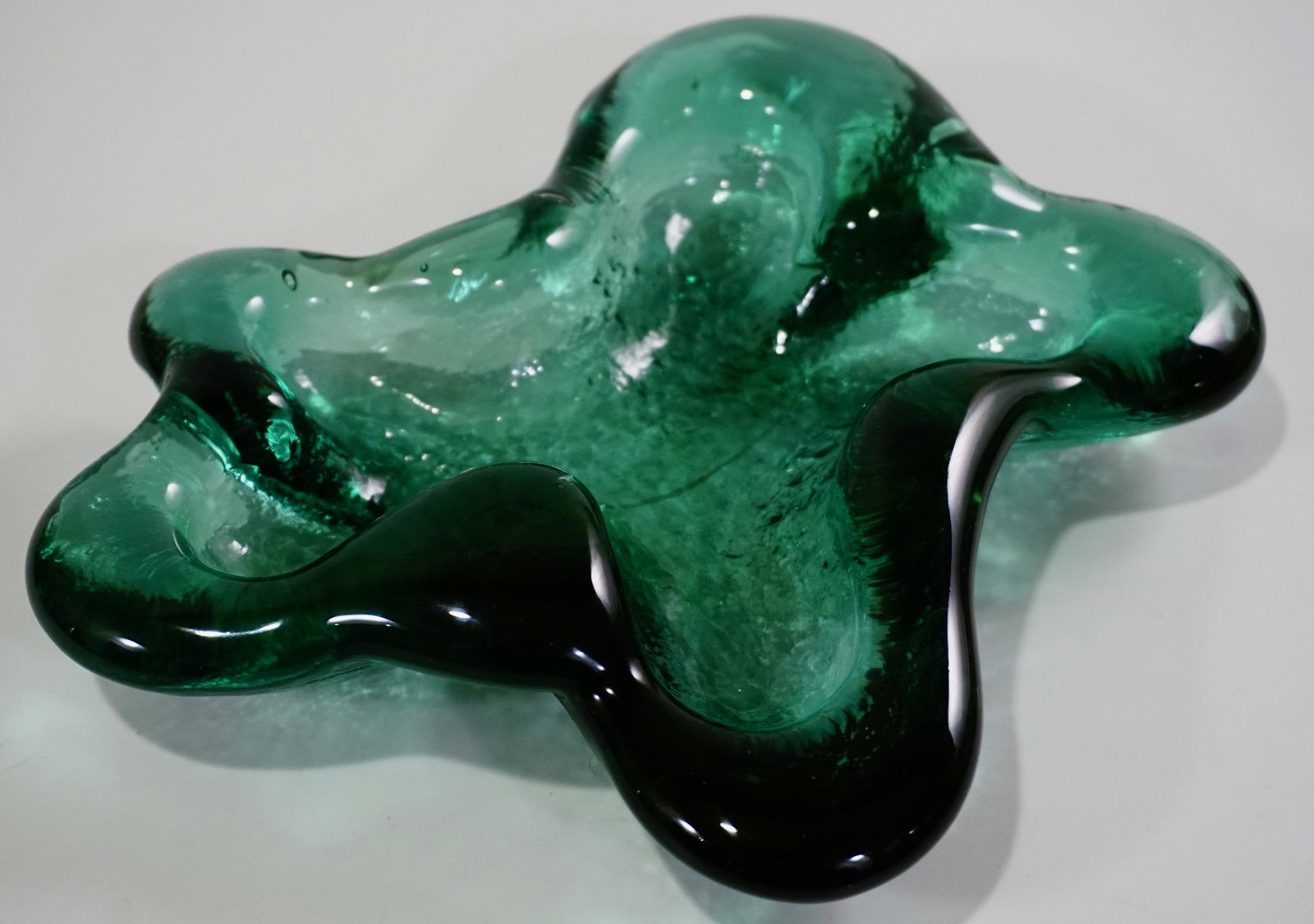 Mid Century Green Art Glass Freeform Dish Bowl: Mid Century Green Art Glass Freeform Dish Bowl Approximately 1 3/8 x 8 9/16 x 7 1/16 inches.