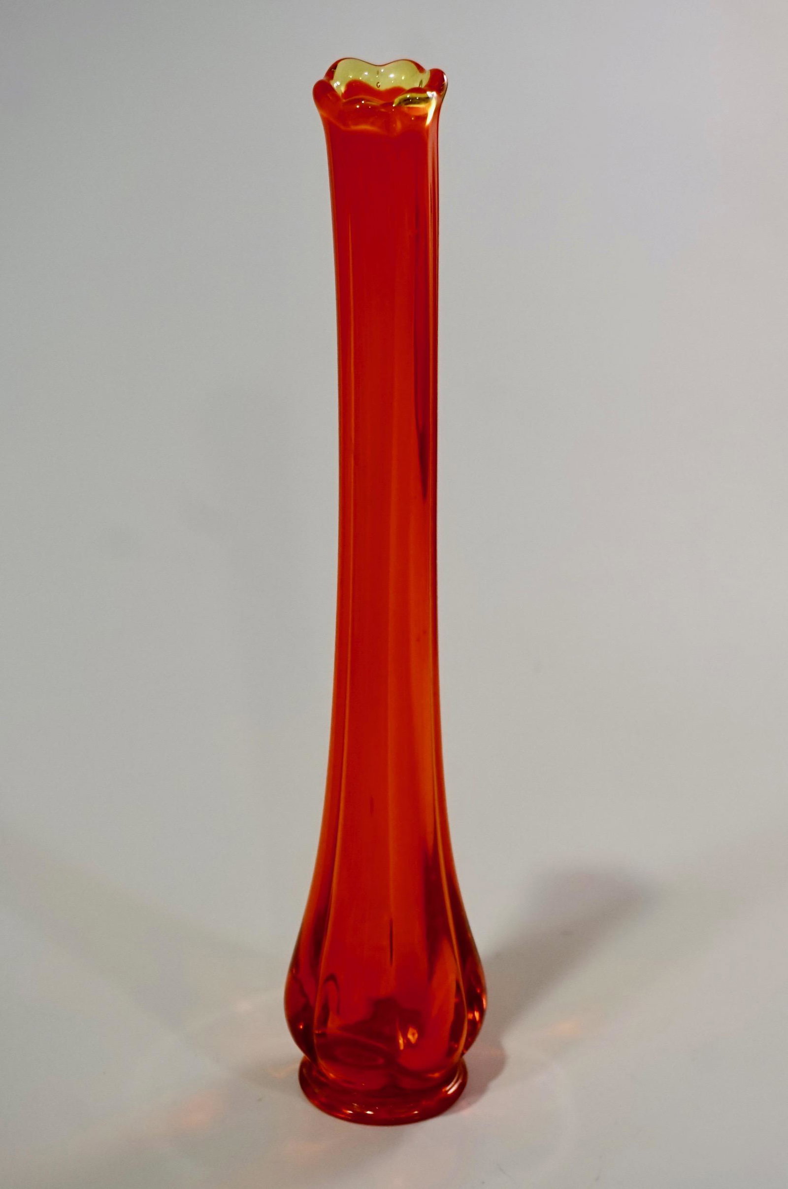 Mid Century Orange Art Glass Stretch Bud Vase: Mid Century Orange Art Glass Stretch Bud Vase Approximately 12 5/8 inches tall.