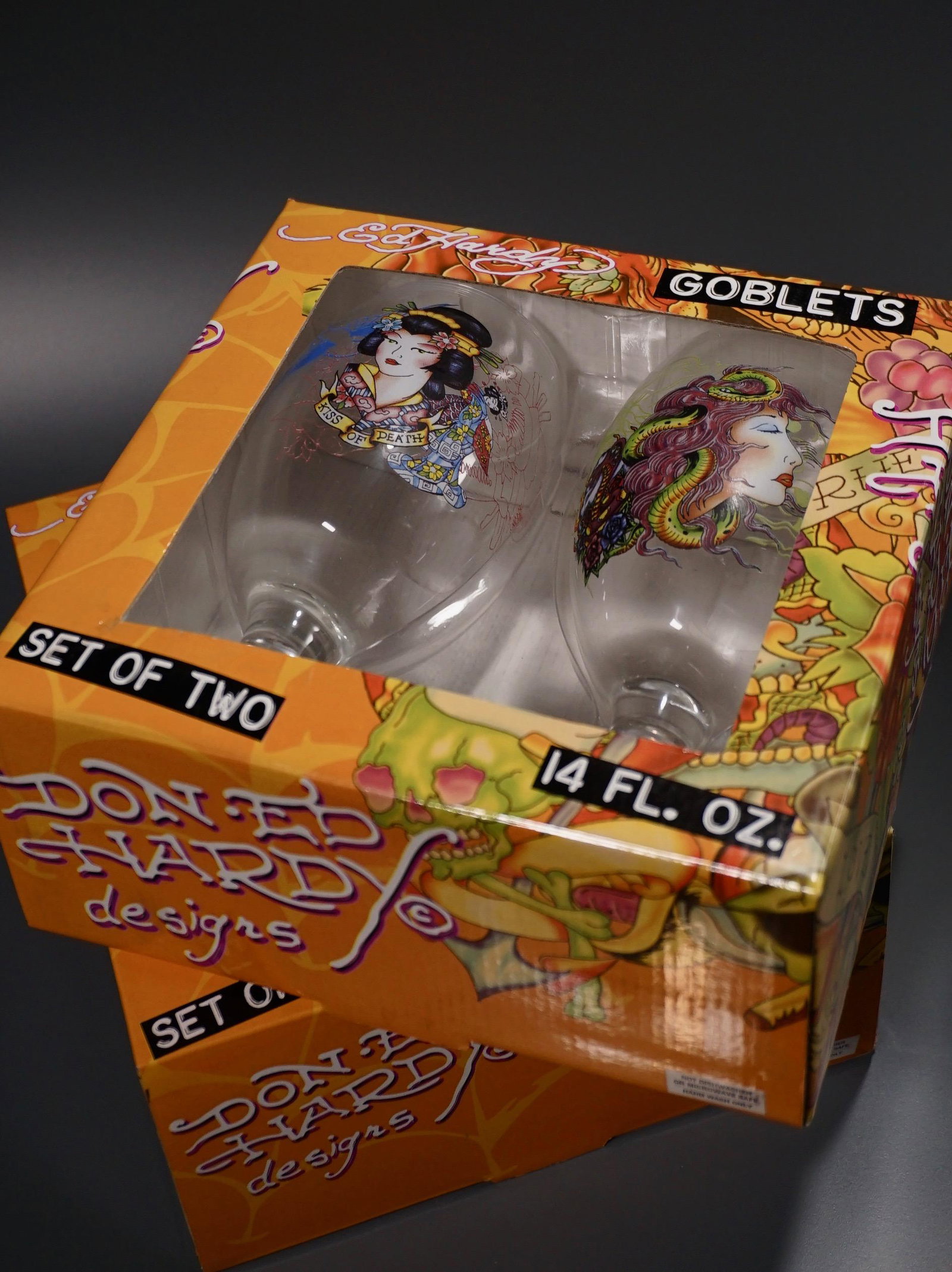 Ed Hardy Tattoo Goblets Wine Glasses Unopened Lot of 2: Ed Hardy Tattoo Goblets Wine Glasses Unopened Lot of 2 Gift Box Sets Approximately 6 3/8 and 7 1/2 inches tall.
