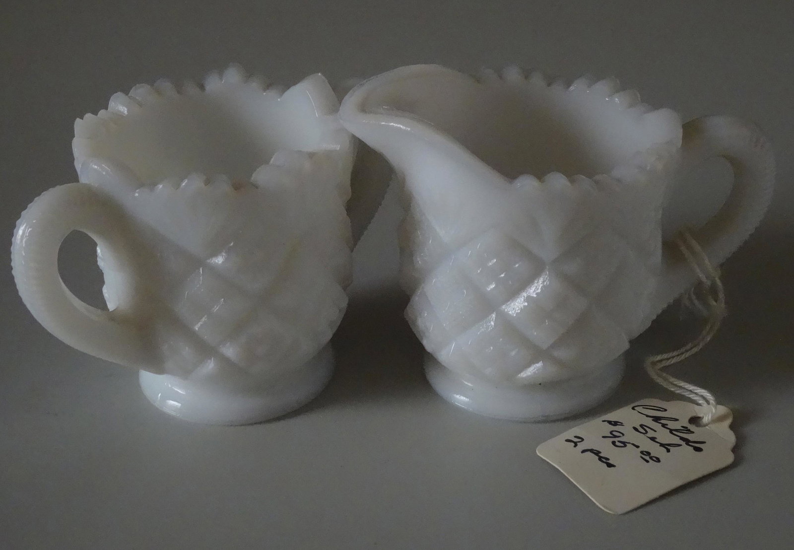 Thumbelina Milk Glass Child Tea Party Creamer Sugar Wes: Thumbelina Milk Glass Child Tea Party Creamer Sugar Westmoreland Antique Store Old Label The sugar bowl is approximately 2 3/8å” inches tall. The creamer is approximately 2 3/8å” inches tall.