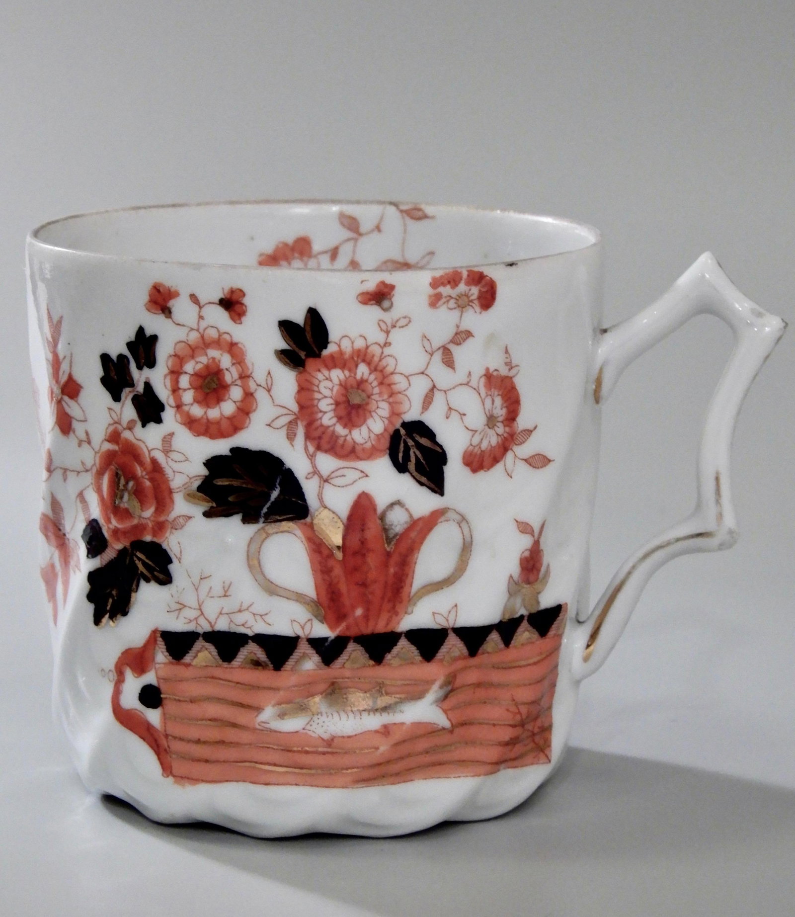 Antique English Imari China Mustache Cup with Gold Fish: Antique English Imari China Mustache Cup with Gold Fish Approximately 31/4 inches tall and 3 3/8 inches in diameter.