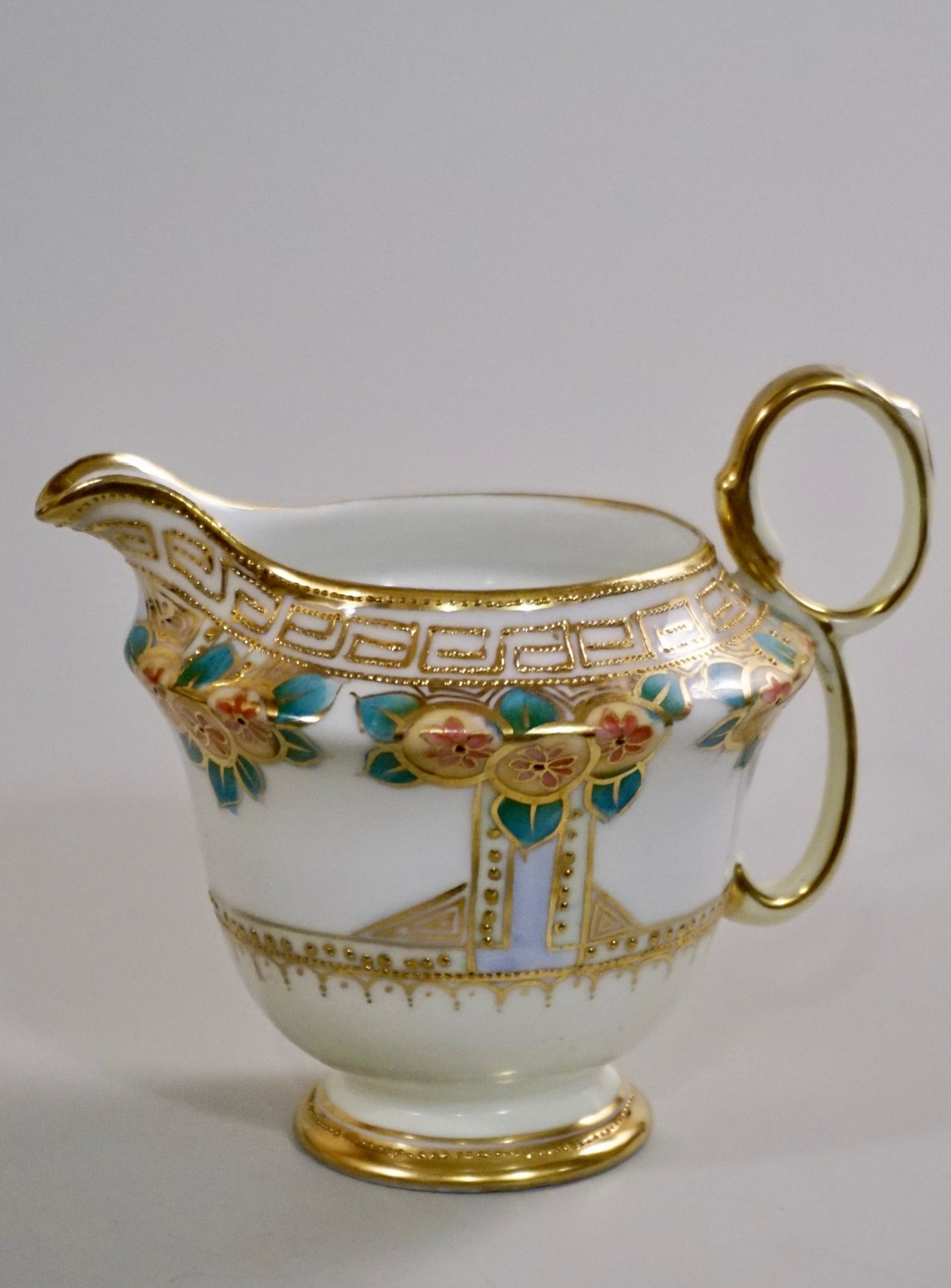 Nippon Porcelain Gold Moriage Cream Pitcher: Nippon Porcelain Gold Moriage Cream Pitcher Approximately 5 1/4 x 4 x 4 1/2 inches tall.