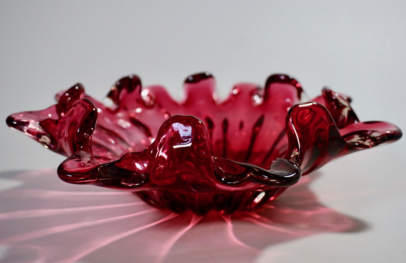 Mid Century Cranberry Art Glass Pontil Blown Bowl: Mid Century Cranberry Art Glass Blown Bowl Polished Pontil Approximately inches 9 1/2 across x 2 9/16 inches tall.