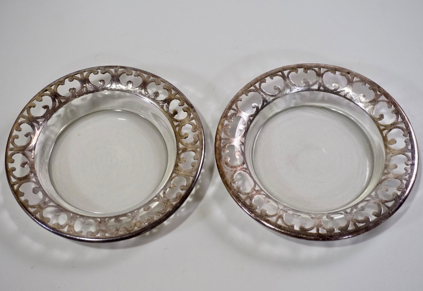 Sterling Silver Overlay Glass Plate Lot of 2: Sterling Silver Overlay Glass Plate Lot of 2 Approximately 4 5/8 inches in diameter.