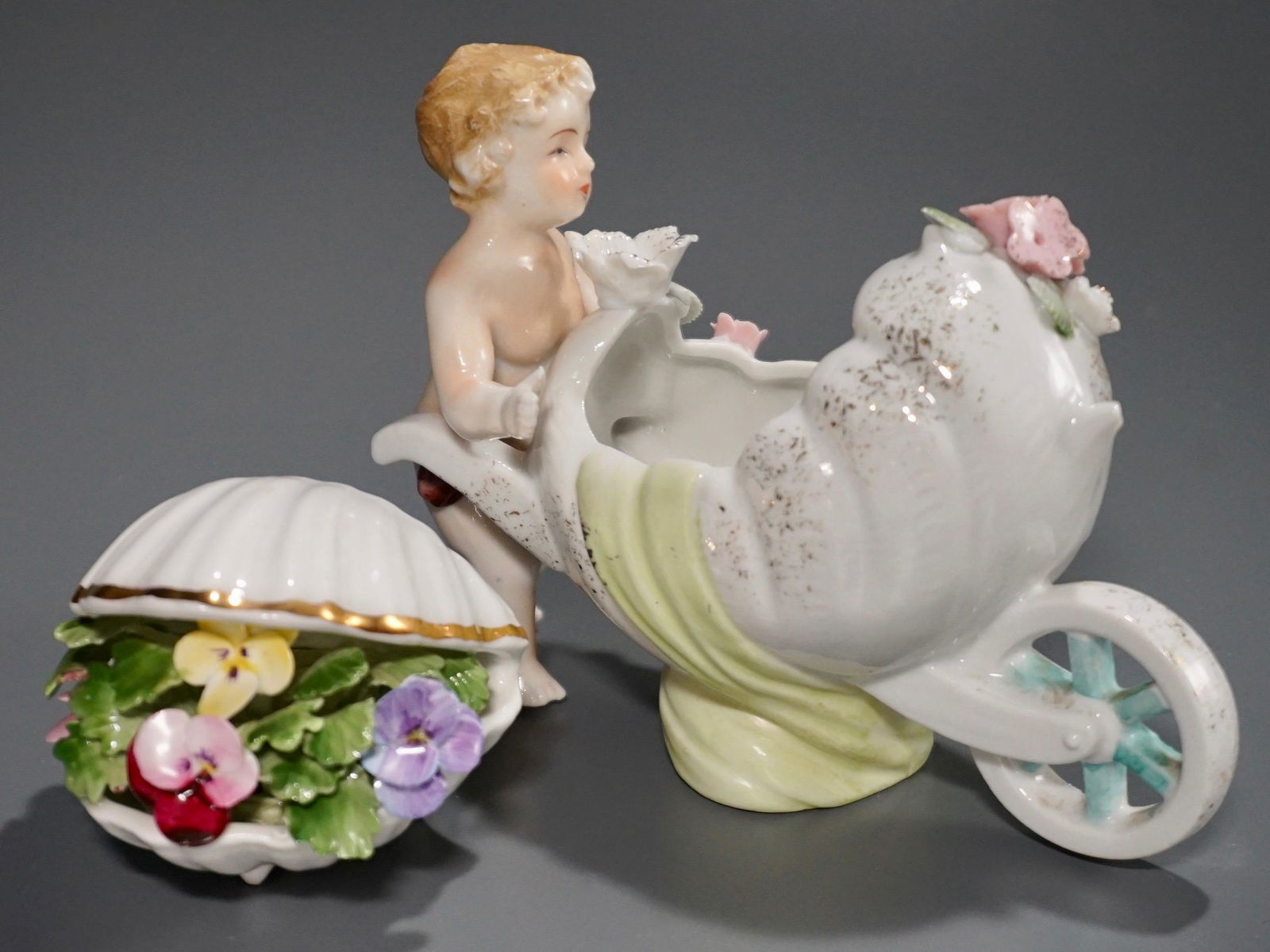 Putti Wheelbarrow Shell Porcelain Flowers Decor Royal: Putti Wheelbarrow Shell Porcelain Flowers Decor Royal Adderley Bone China Approximately 5 7/8 x 2 1/2 x 4 1/4 inches tall and 3 x 3 1/8 x 2 7/16 inches tall.