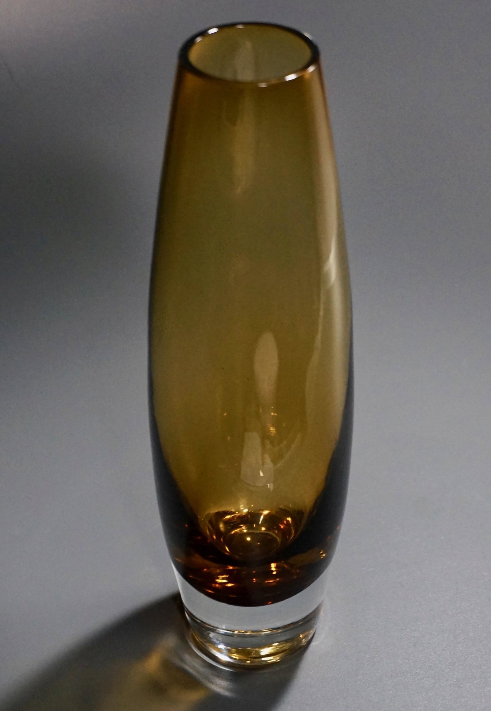 Mid Century Amber Glass Vase Weighted Base: Mid Century Amber Glass Vase Weighted Base Approximately 10 5/8 inches tall.