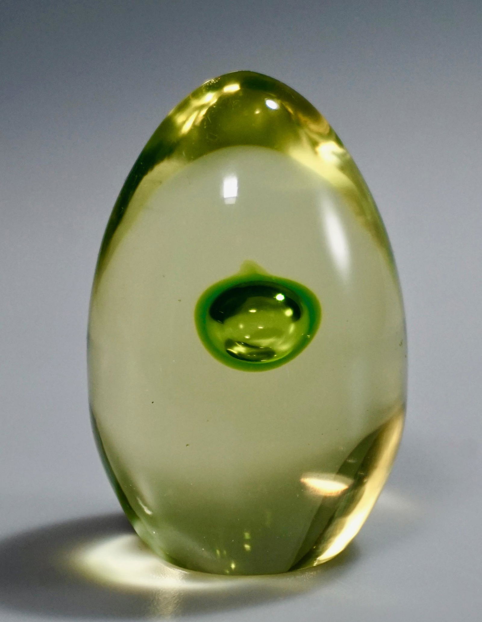 Vaseline Art Glass Egg Paperweight Gumps Store Sticker: Vaseline Art Glass Egg Paperweight Gumps Store Sticker Approximately 2 7/8 inches tall.