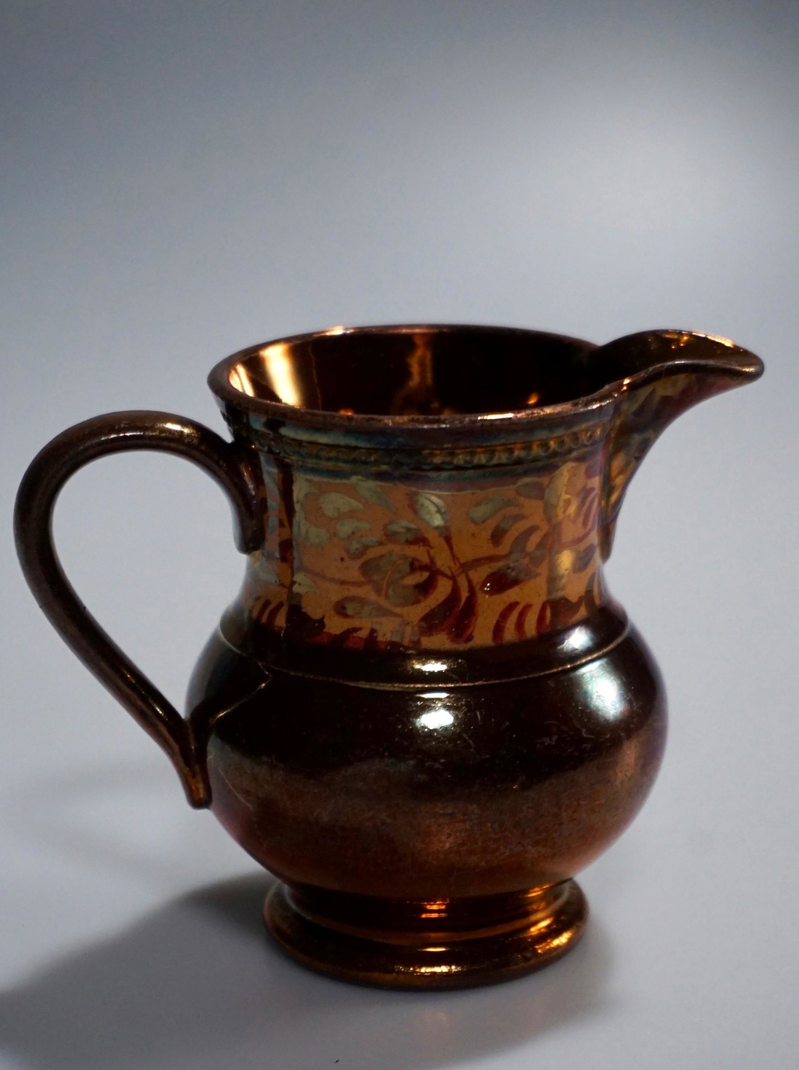 English Copper Lustre Antique Cream Jug: English Copper Lustre Antique Cream Jug Approximately 4 1/4 x 2 3/4 x 3 3/8 inches tall.