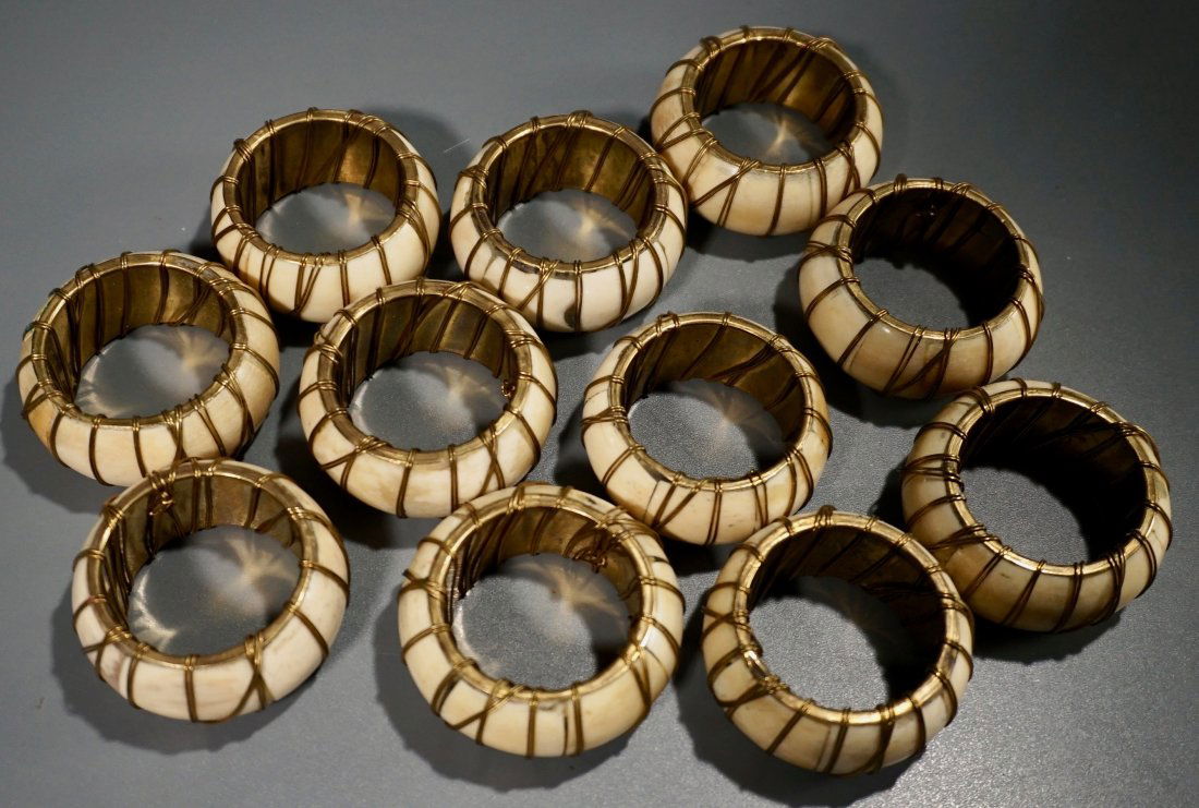 Bone & Brass Napkin Rings Lot of 11: Bone & Brass Napkin Rings Lot of 11 Approximately 2 1/8 inches in diameter.