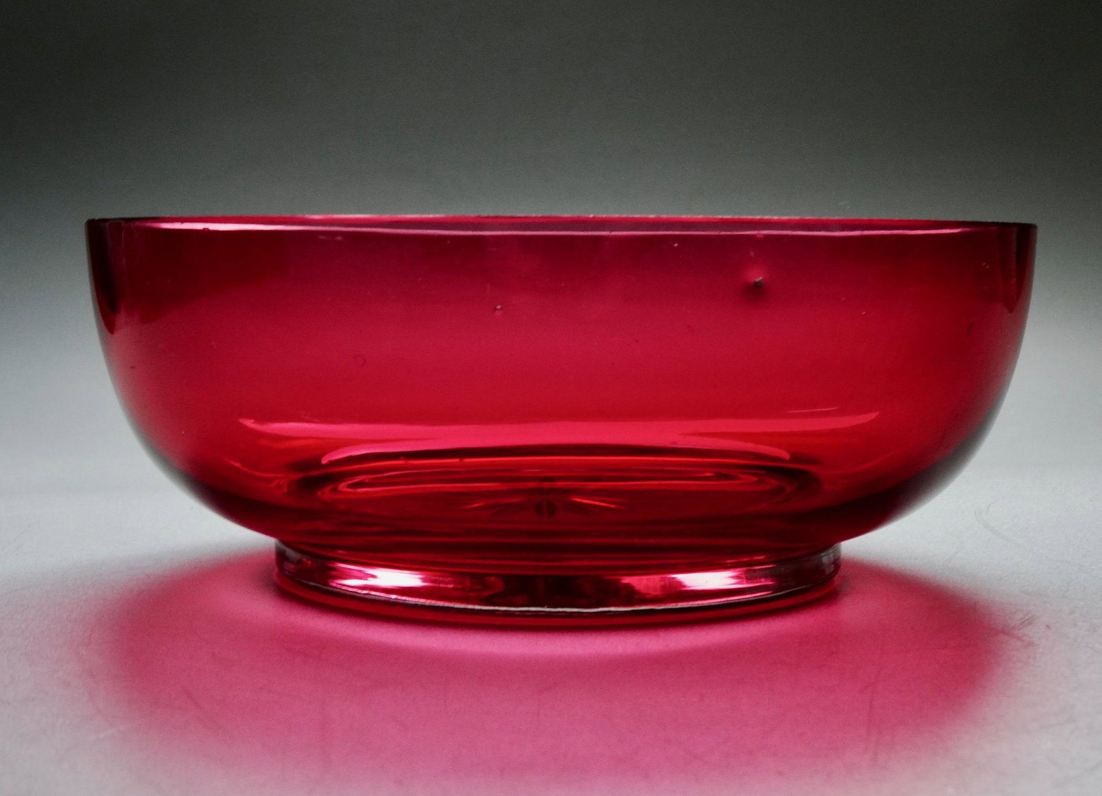 Antique Cranberry Star Cut Glass Bowl: Antique Cranberry Star Cut Glass Bowl Approximately 2 1/16 x 5 13/16 inches in diameter.