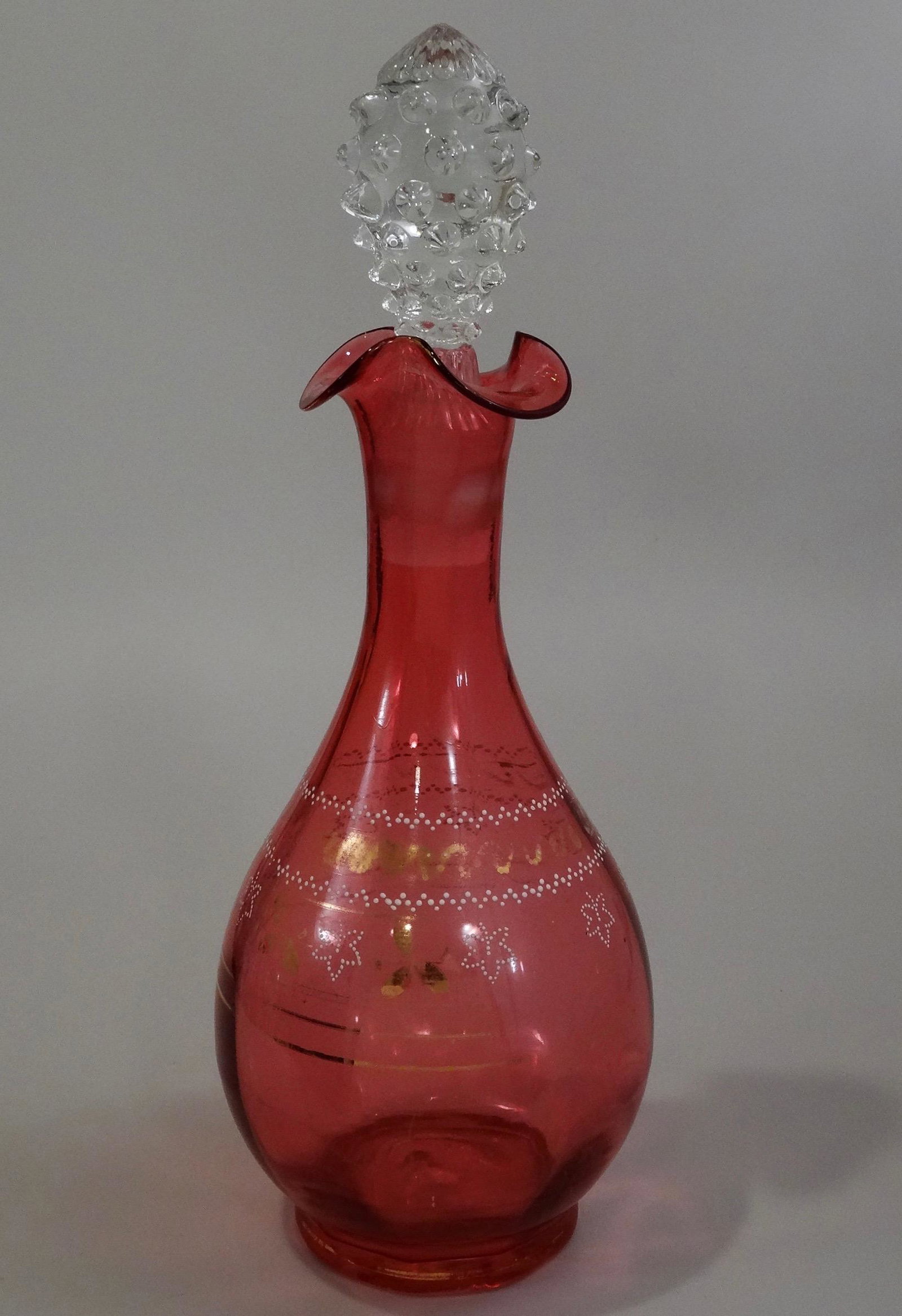 Bohemian Cranberry Art Glass Decanter Enamel Gilded: Bohemian Cranberry Art Glass Decanter Enamel Gilded Highlights 11 1/8 inches tall x 4 1/6 inches in diameter.