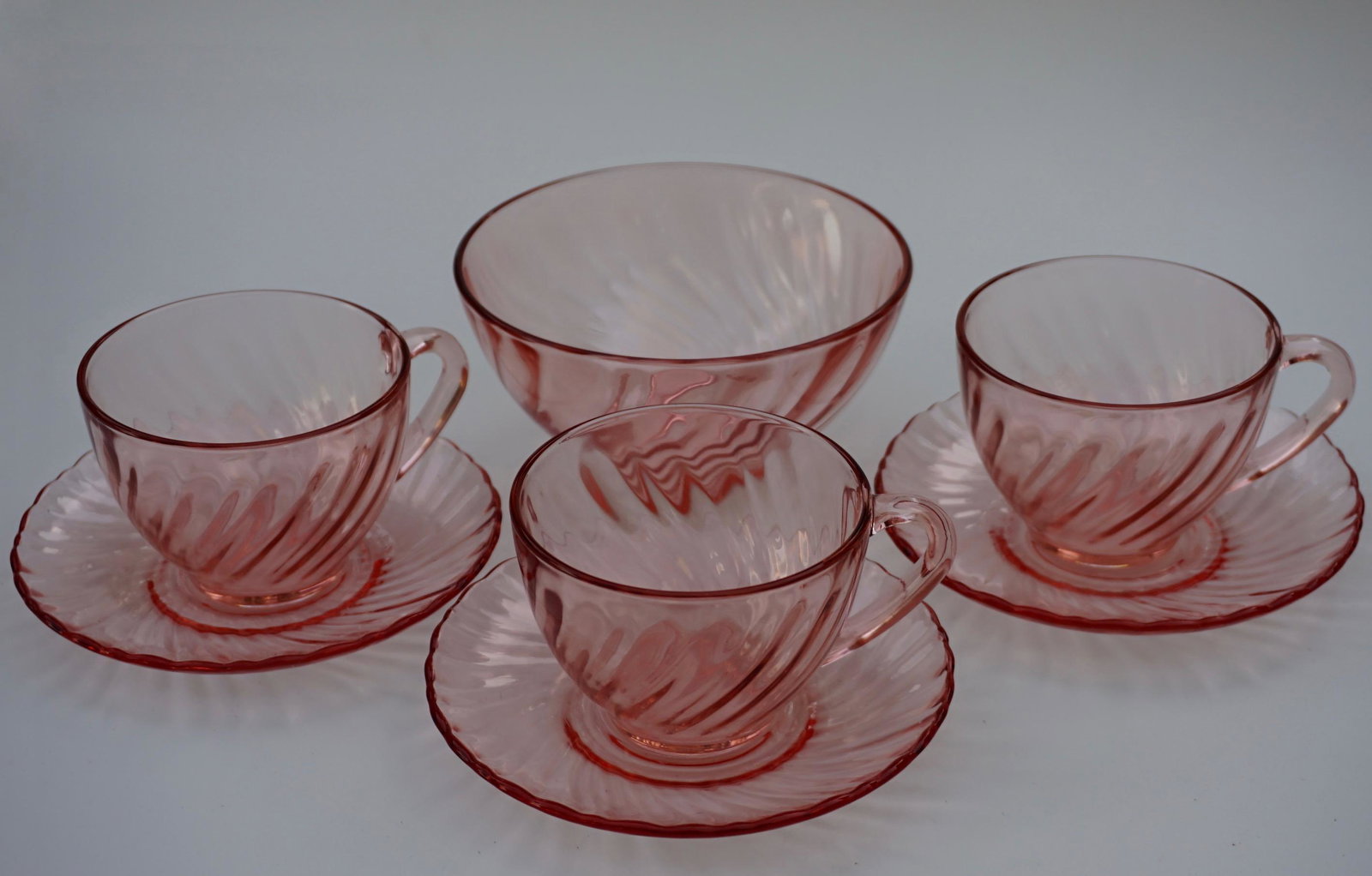 French Rosaline Arcoroc Pink Swirl Glass Cup Saucer: French Rosaline Arcoroc Pink Swirl Glass Cup Saucer Bowl Set Cups are approximately 4 1/4 x 3 1/2 x 2 9/16 inches; saucers are 5 1/4 inches in diameter; bowl is 2 9/16 x 5 1/4 inches in diameter.