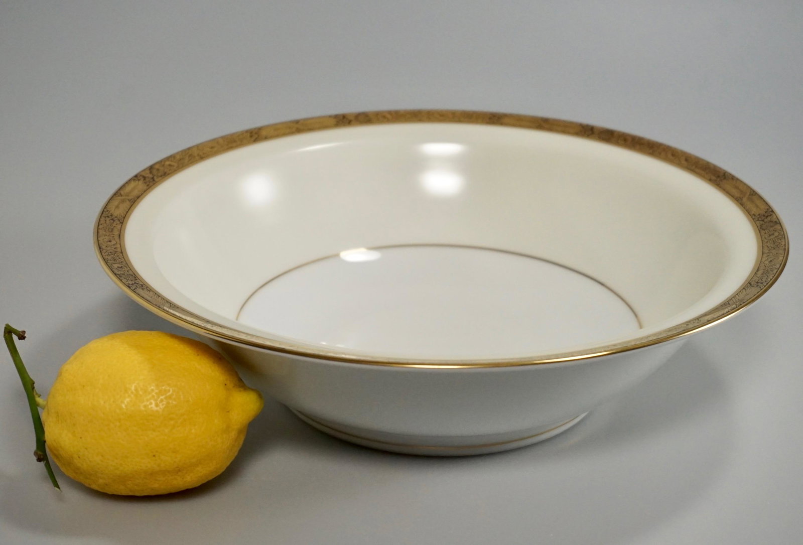 10 inch Round Goldkin Serving Bowl by Noritake: 10 inch Round Goldkin Serving Bowl by Noritake Approximately 2 1/2 x 10 inches in diameter.