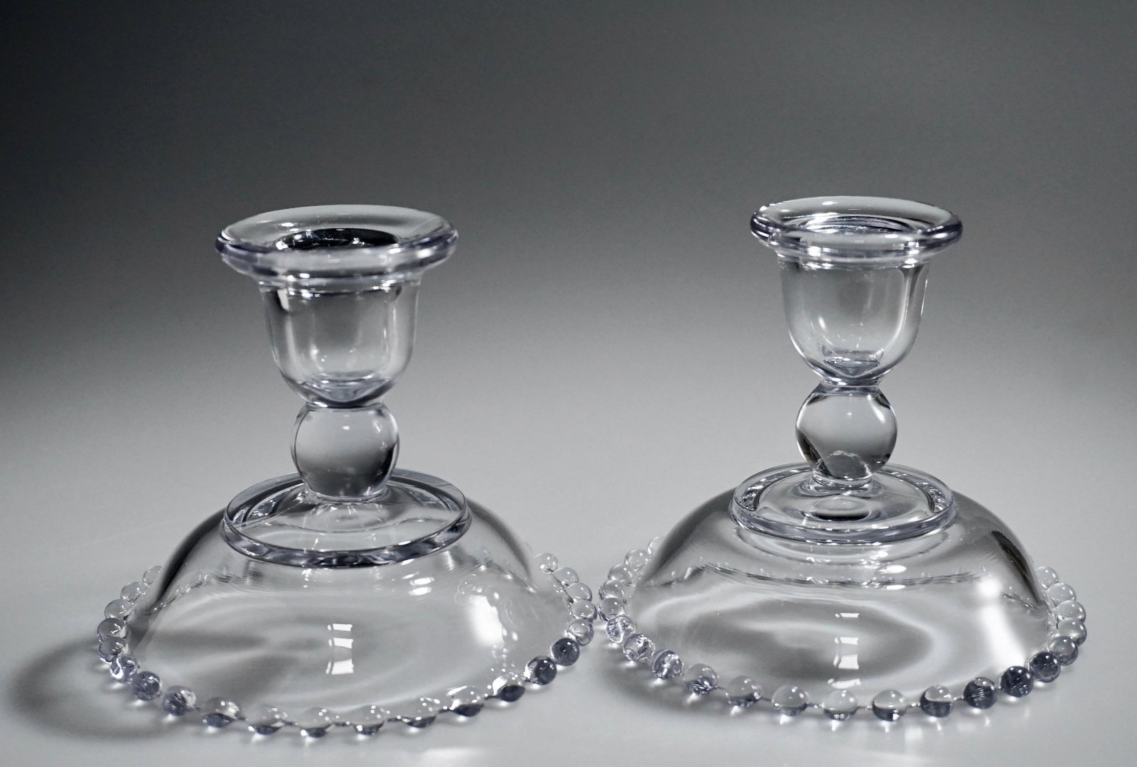 Vintage Imperial Glass Candleholders on Beaded Base Lot: Vintage Imperial Glass Candleholders on Beaded Base Lot of 2 Candlewick Pressed Candle Holders Approximately 3 1/2 x 4 1/4 inches in diameter.