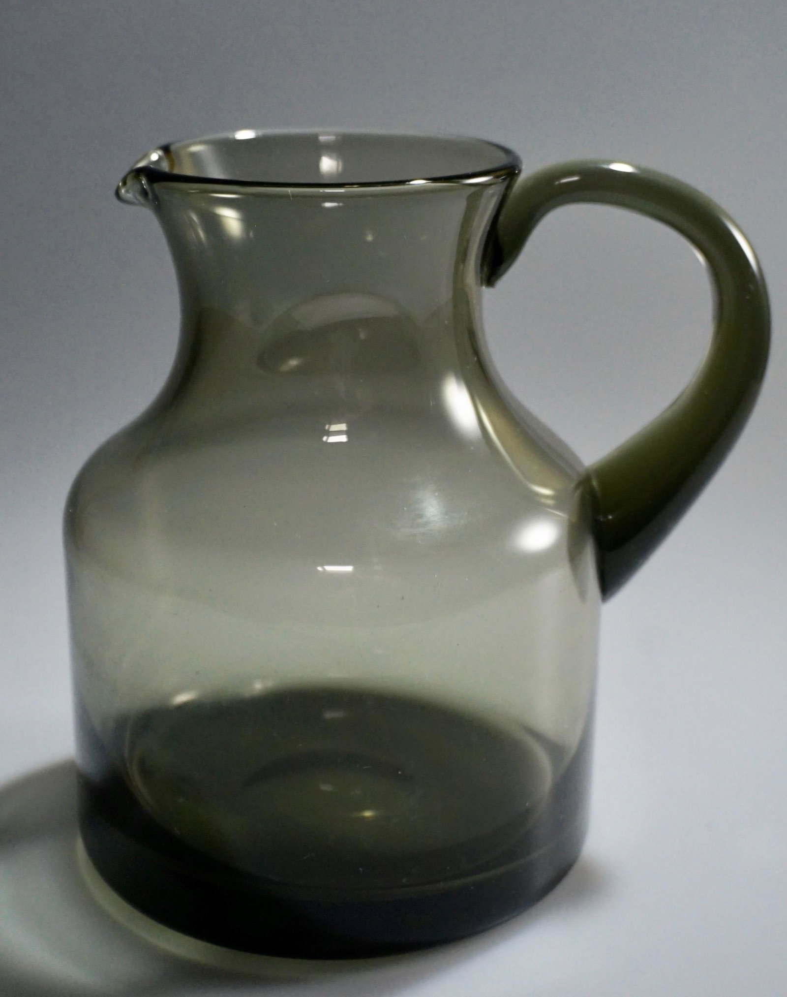 Mid Century Smoked Glass Polished Pontil Pitcher: Mid Century Smoked Glass Polished Pontil Pitcher Approximately 5 1/4 x 4 3/16 x 5 7/16 inches.