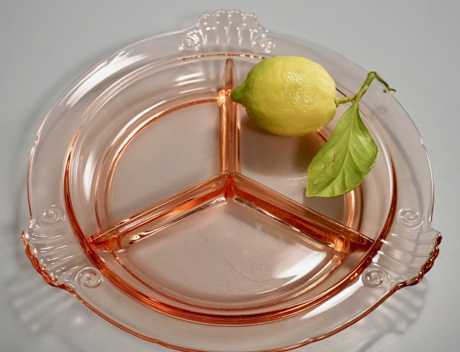 Art Deco Pink Depression Glass Divided Dish: Art Deco Pink Depression Glass Divided Dish Approximately 1 x 9 3/4 inches across.