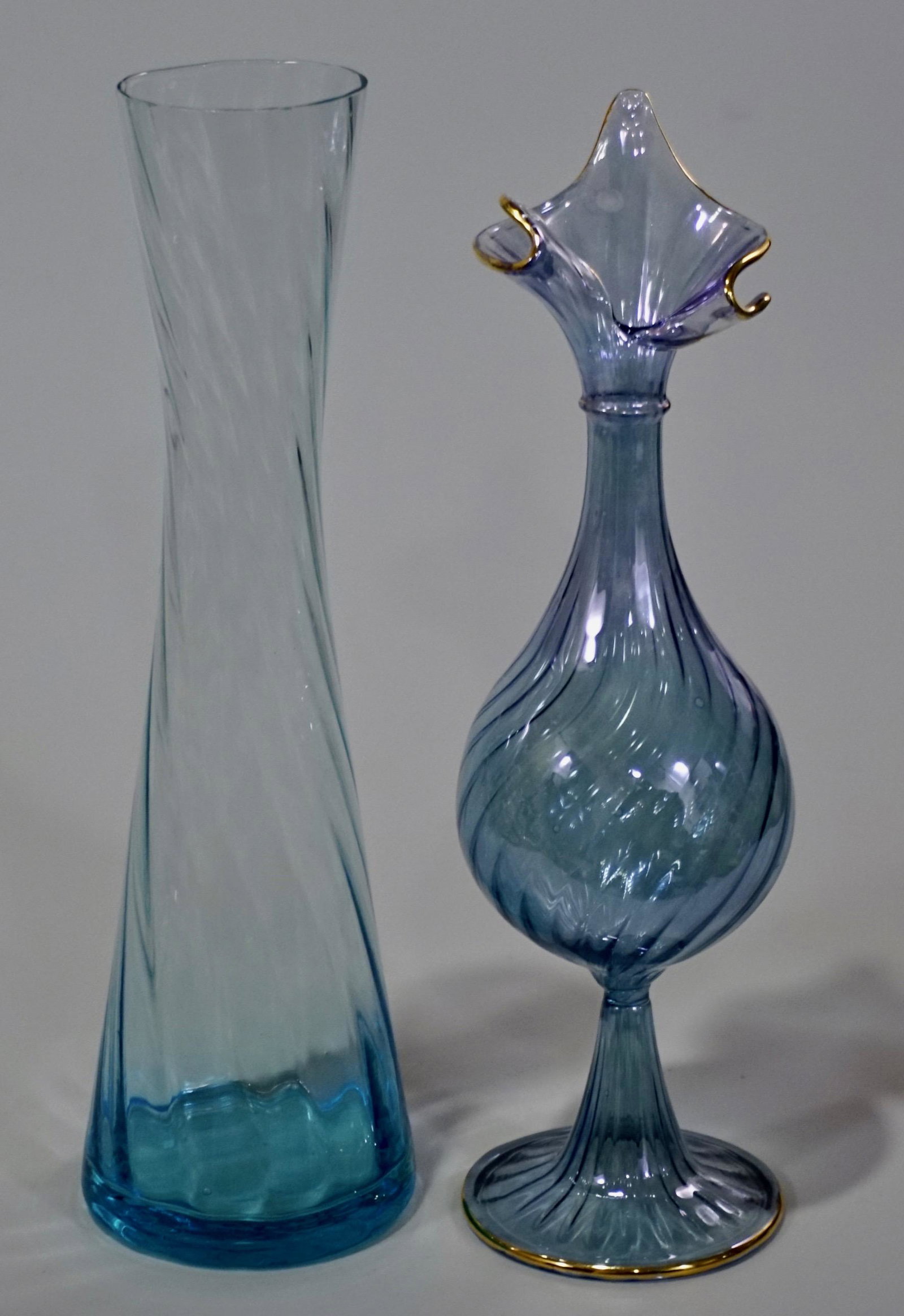 Thin Twisted Blue Glass Vase Lot of 2: Thin Twisted Blue Glass Vase Lot of 2 Approximately 8 3/8 inches and 8 11/16 inches tall.